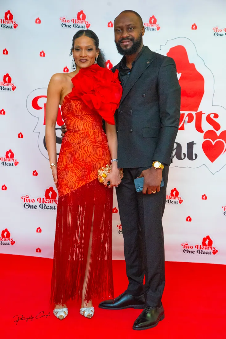 A couple in red and black on the red carpet