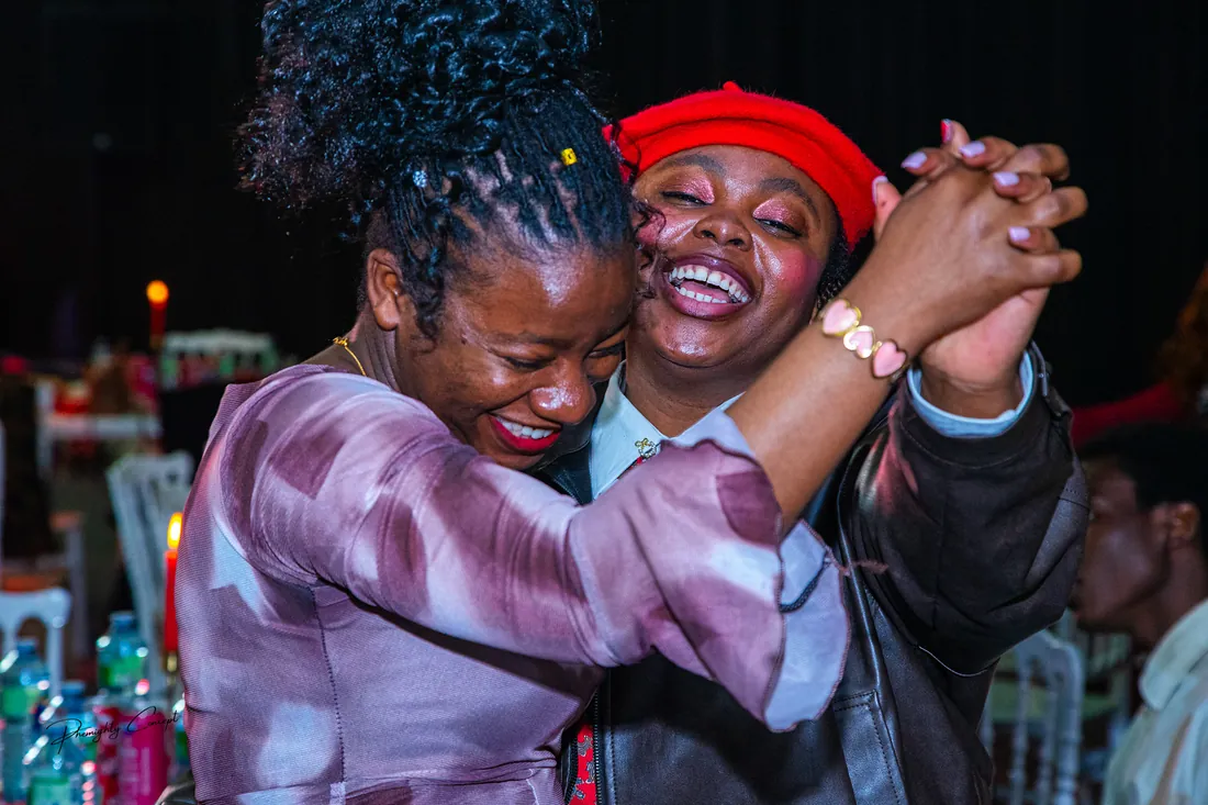 Two guests dancing and laughing