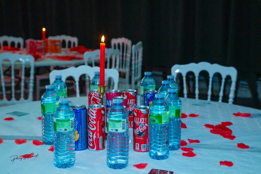Candlelit tables scattered with red petals